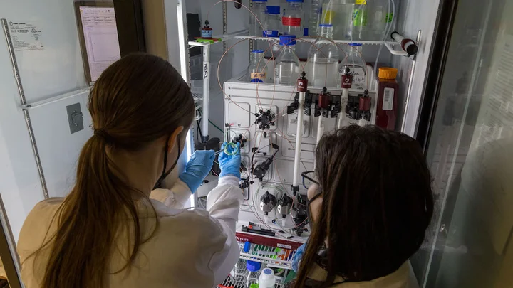 People working with lab equipment in the Gonen Lab